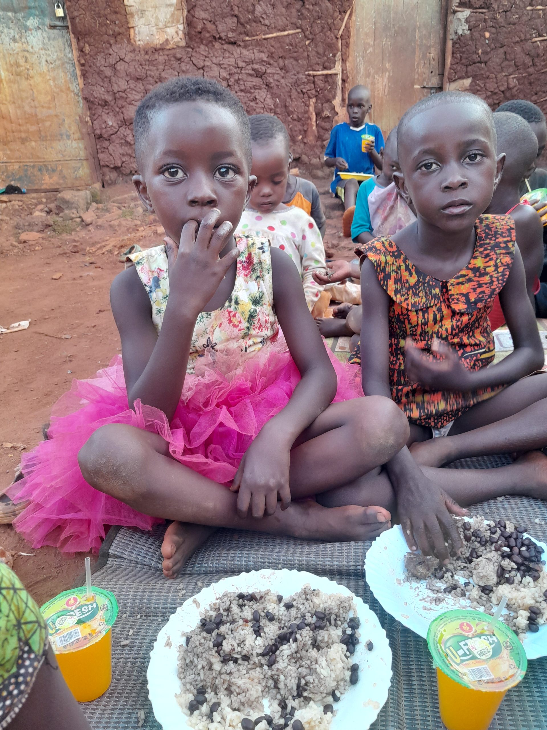Children receiving food support from Mission of Hope Foundation Uganda.